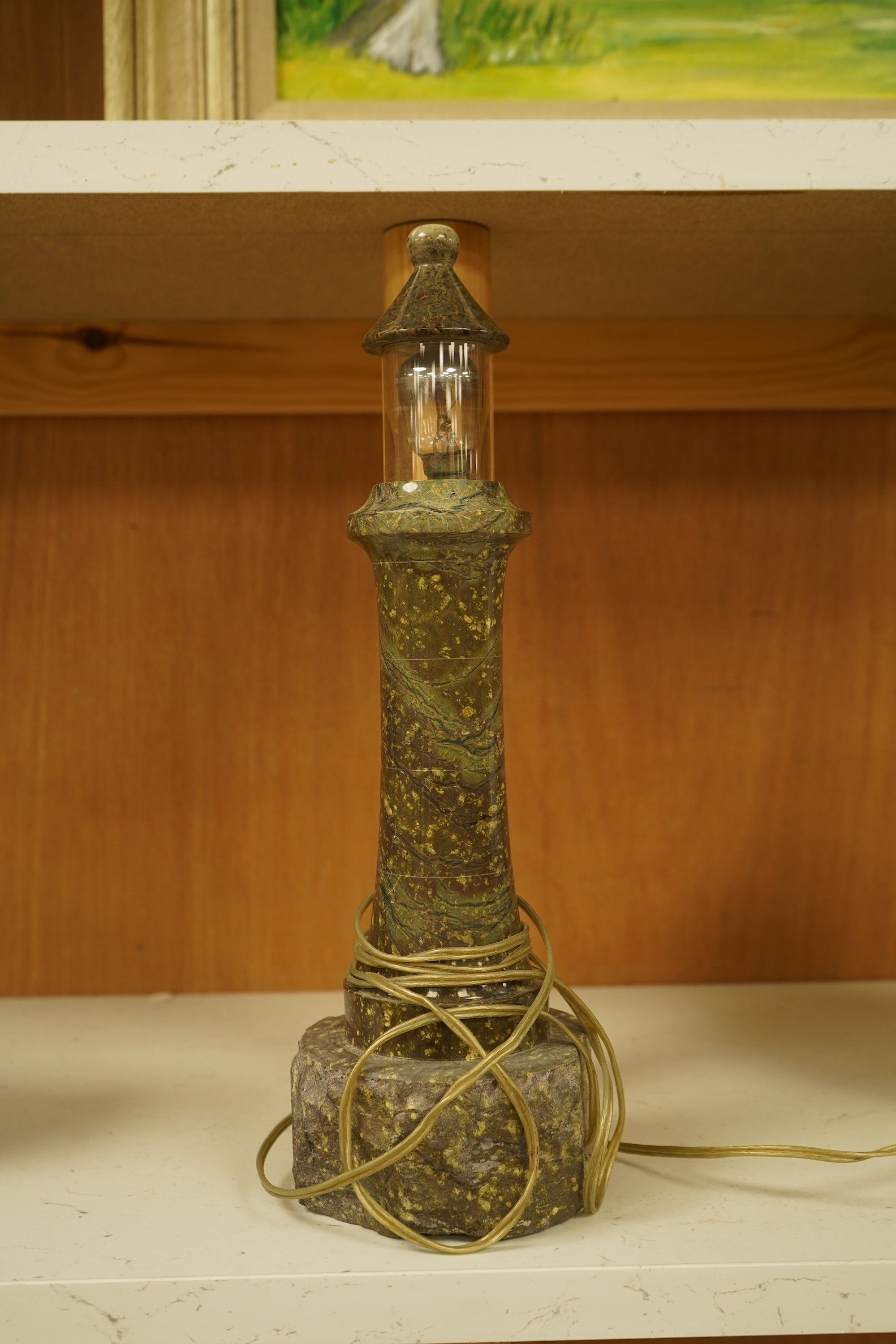 A Cornish serpentine lighthouse table lamp, 33cm high